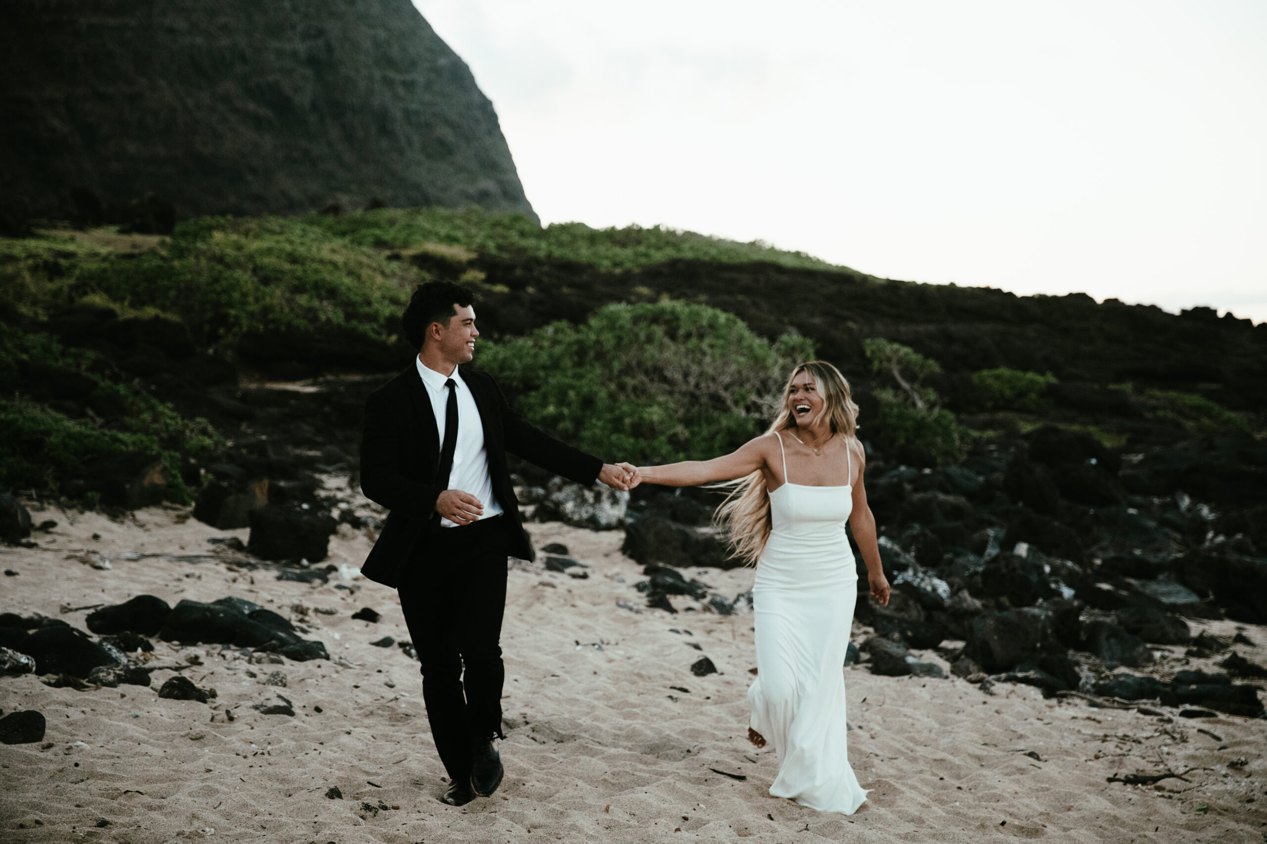 A couple eloping on a beach in Oahu, Hawaii