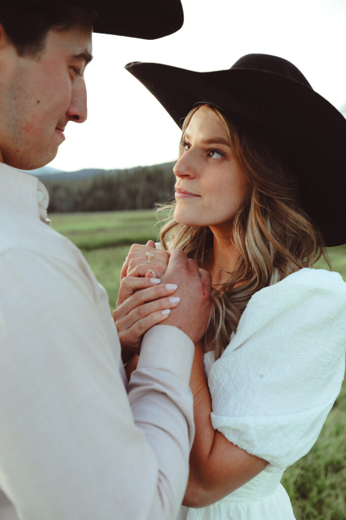 A girl looking her fiance in the eyes